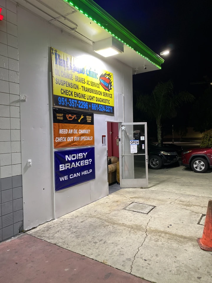 Ray's Auto Clinic sign and shop door lit up at night on Florida Ave