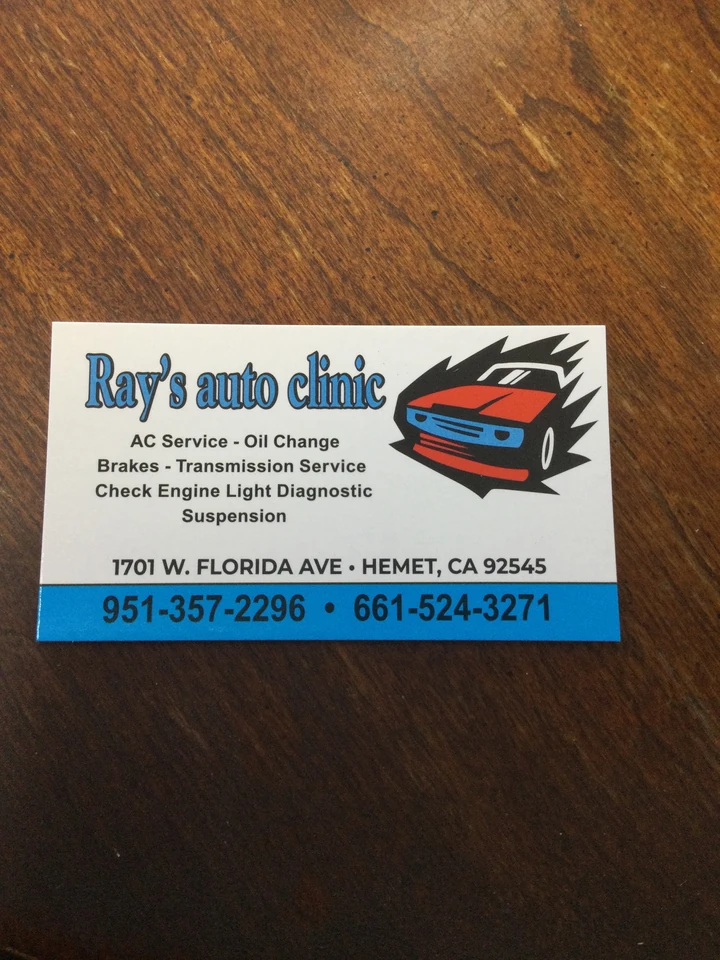 Ray's Auto Clinic business card listing AC service, oil change, brakes and more